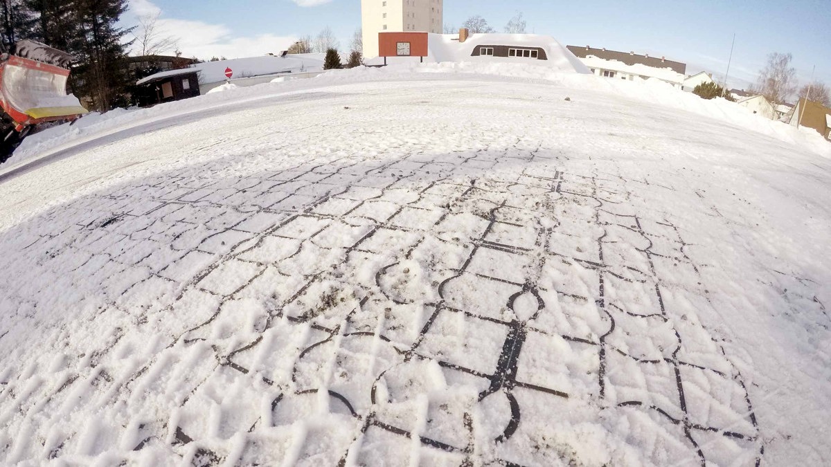 EcoGrid permeable paving system covered in snow during winter, demonstrating year-round durability