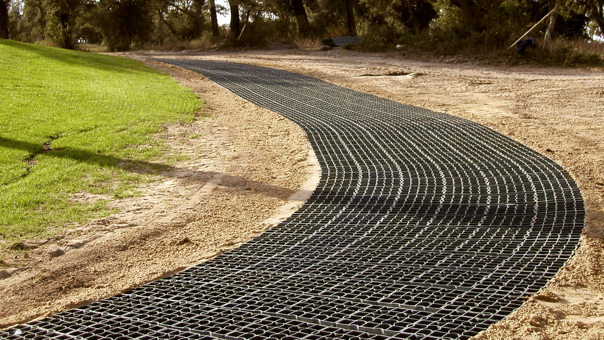 Curved EcoGrid pathway installation on a golf course before being filled with gravel