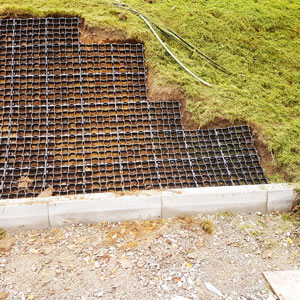 EcoGrid ground reinforcement installed on a steep grass embankment to prevent erosion