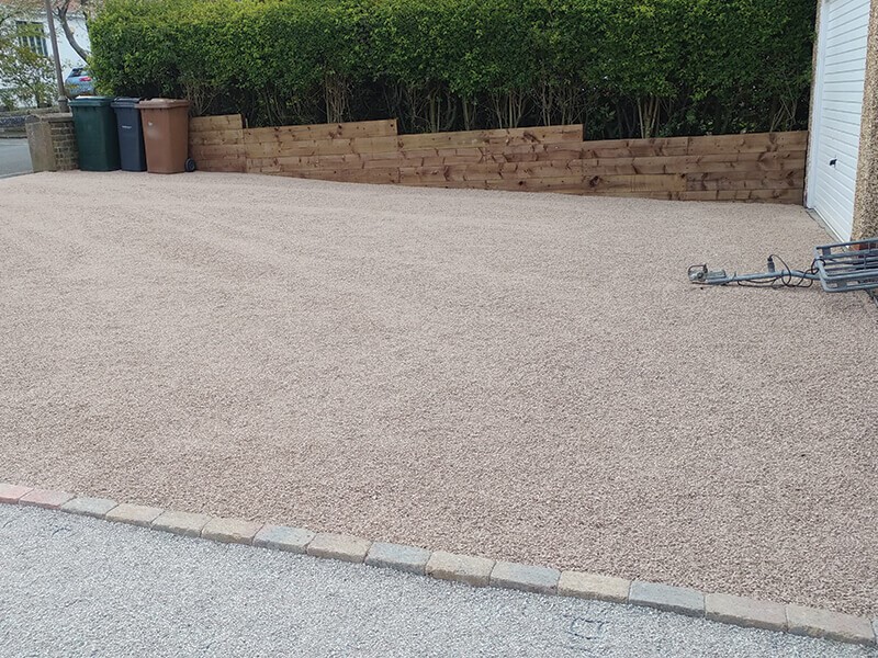 Finished gravel driveway installed using EcoGrid permeable paving for a stable and durable surface