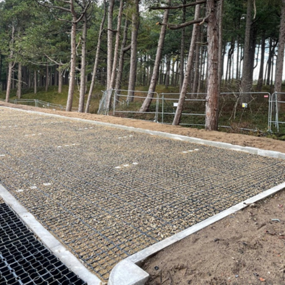 EcoGrid permeable gravel car park installation at Formby Beach, creating a durable, free-draining parking surface that helps protect the surrounding coastal environment